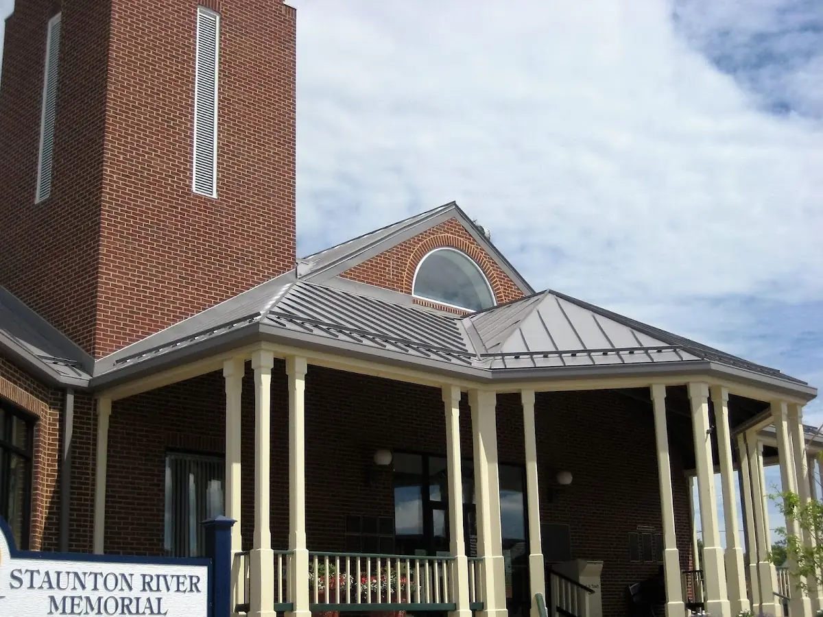 Skilled roofing craftsmen working on a residential roof in Sylacauga